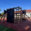 Axel Kletteranlage mit Rutsche und Kletterwand auf Spielplatz