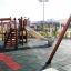 Kinder-Spielplatz mit Rutsche und Fallschutzplatte 35 auf sicherem Bodenbelag.