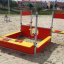 Farbenfroher Jupiter Sandkasten im Freien auf einem Spielplatz.
