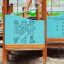 Epsilon Barrierefreie Spielplatz mit interaktivem Spielpanel und kindgerechtem Design aus Holz und K