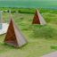 Tipi Spielhaus aus Holz auf dem Spielplatz in der grünen Wiese