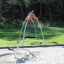 Nestschaukel Solaris (BNS 120 cm) auf einem Spielplatz im Freien.