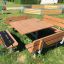 Holztisch mit Bänken im Freien, ideal für Park- und Gartenanlagen.