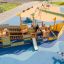 Bounty Spielschiff mit Tunnel und Rutsche auf einem bunten Spielplatz.