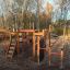 Panther Kletteranlage aus Holz mit Rutsche und Kletternetz im Freien