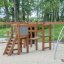 Holzspielgerät Panther Kletteranlage für Kinder auf einem Spielplatz mit Rutsche und Kletterelemente