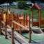 Barrierefreier Kinderspielplatz Gamma mit Rutschen und Spielhäusern in lebendigen Farben.