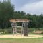 Andromeda Klettergerüst mit Kletterwand in einem öffentlichen Park.