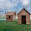 Holzspielhaus Natur Spielhaus für Kinder im Freien auf grünem Gras.